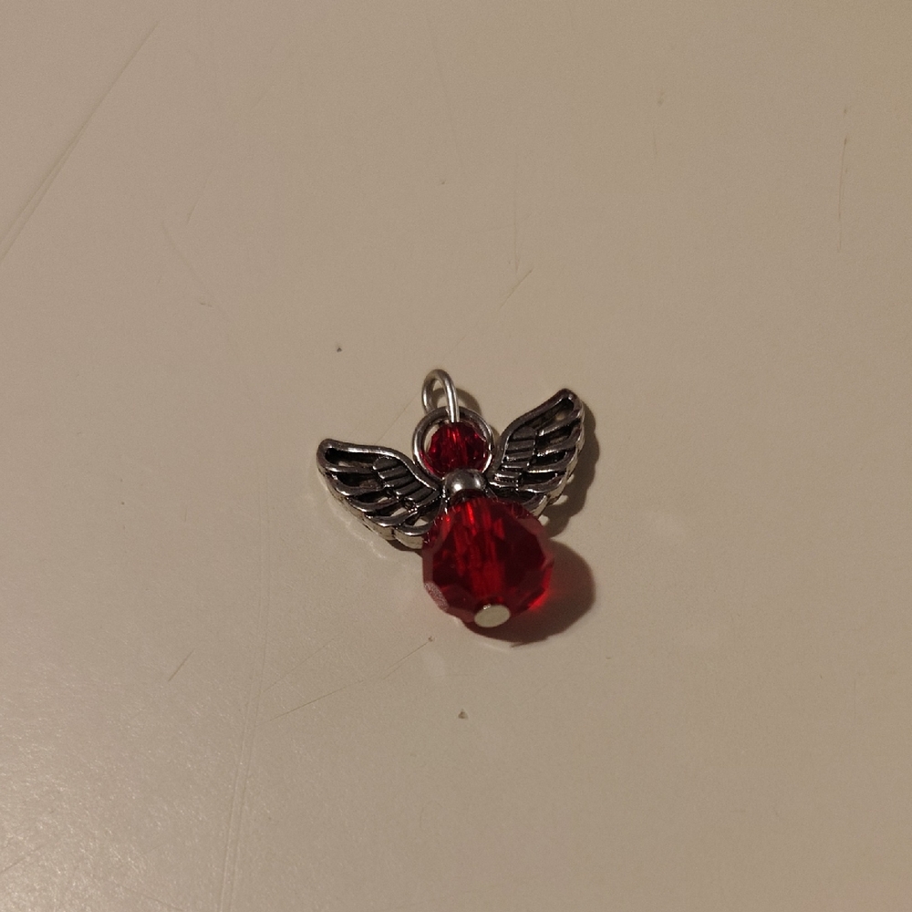 Silver Wing Necklace with Red Gemstone